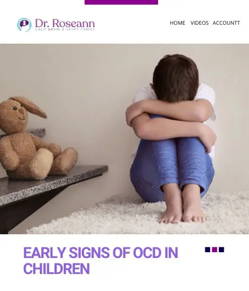 Child sitting against wall with stuffed rabbit beside them