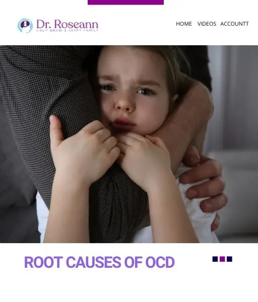 Small child with hands to mouth held by parent