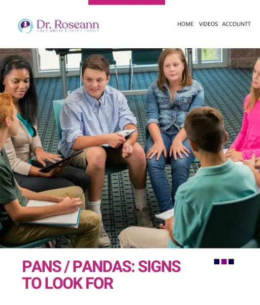 Group of teenagers sitting on floor in circle during support group or therapy session with adult facilitator