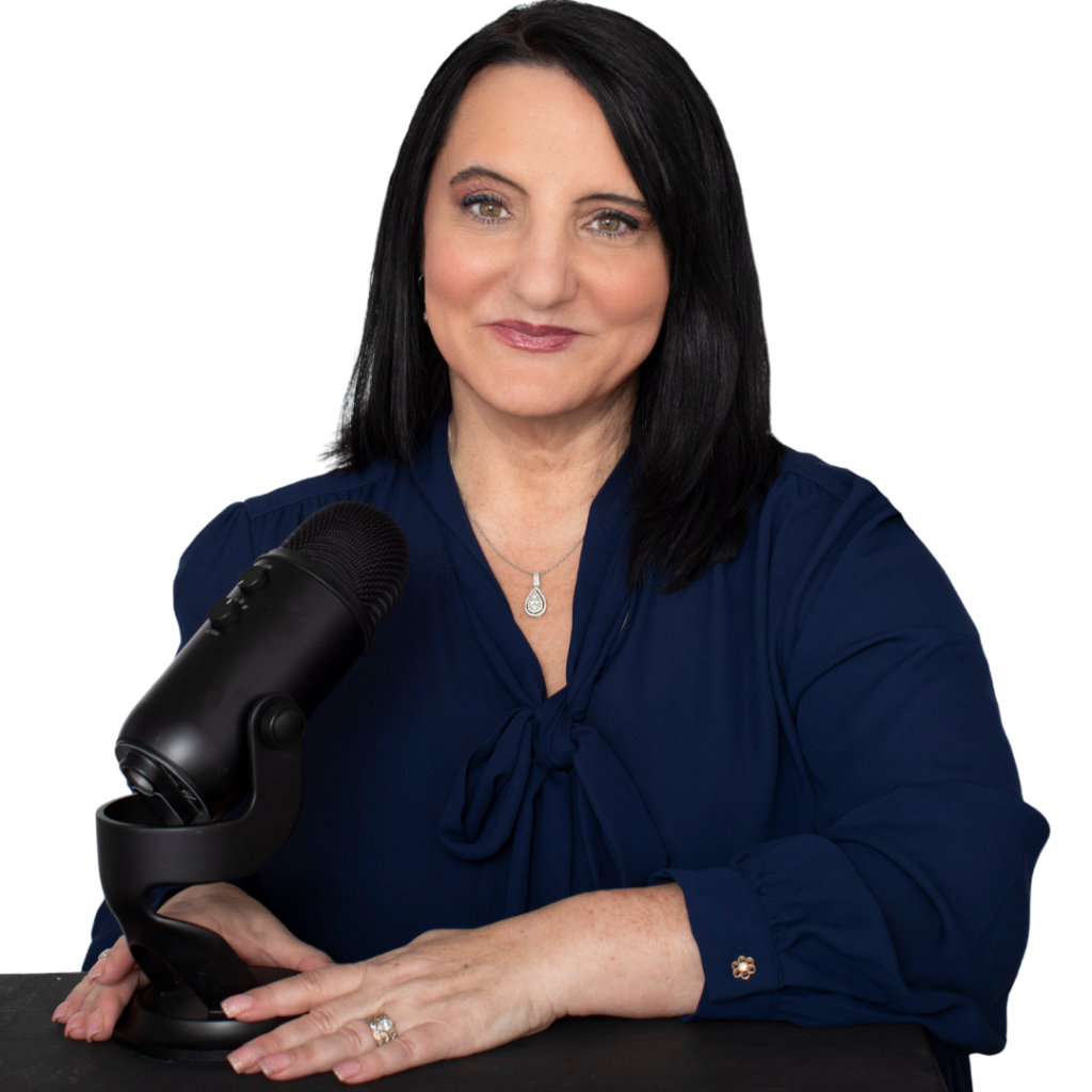 Dr. Roseann Capanna-Hodge professional portrait in dark blue blouse with microphone