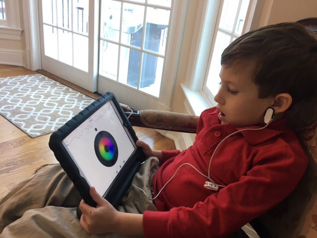 Young boy with tablet - Neurofeedback - Biofeedback