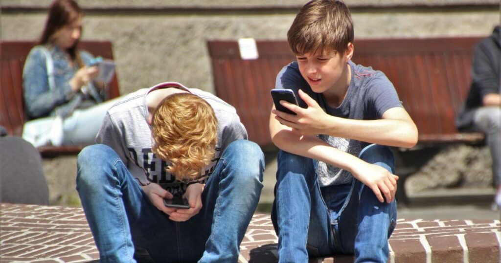 Young Boys with ADHD distracted by cellphone