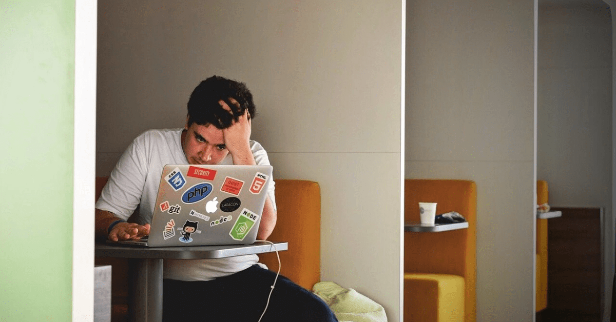 man stressed on computer