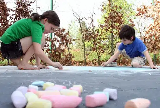 kids using sidewalk chalk - Dr. Roseann