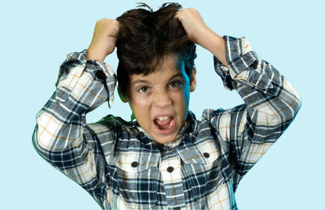 A boy exhibits his hair while posed against a blue background in a media kit visual.