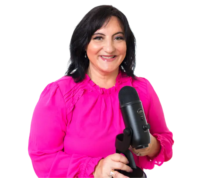 A woman holding a microphone in front of a black background.