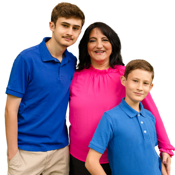 A CALM family posing for a photo in blue polo shirts.