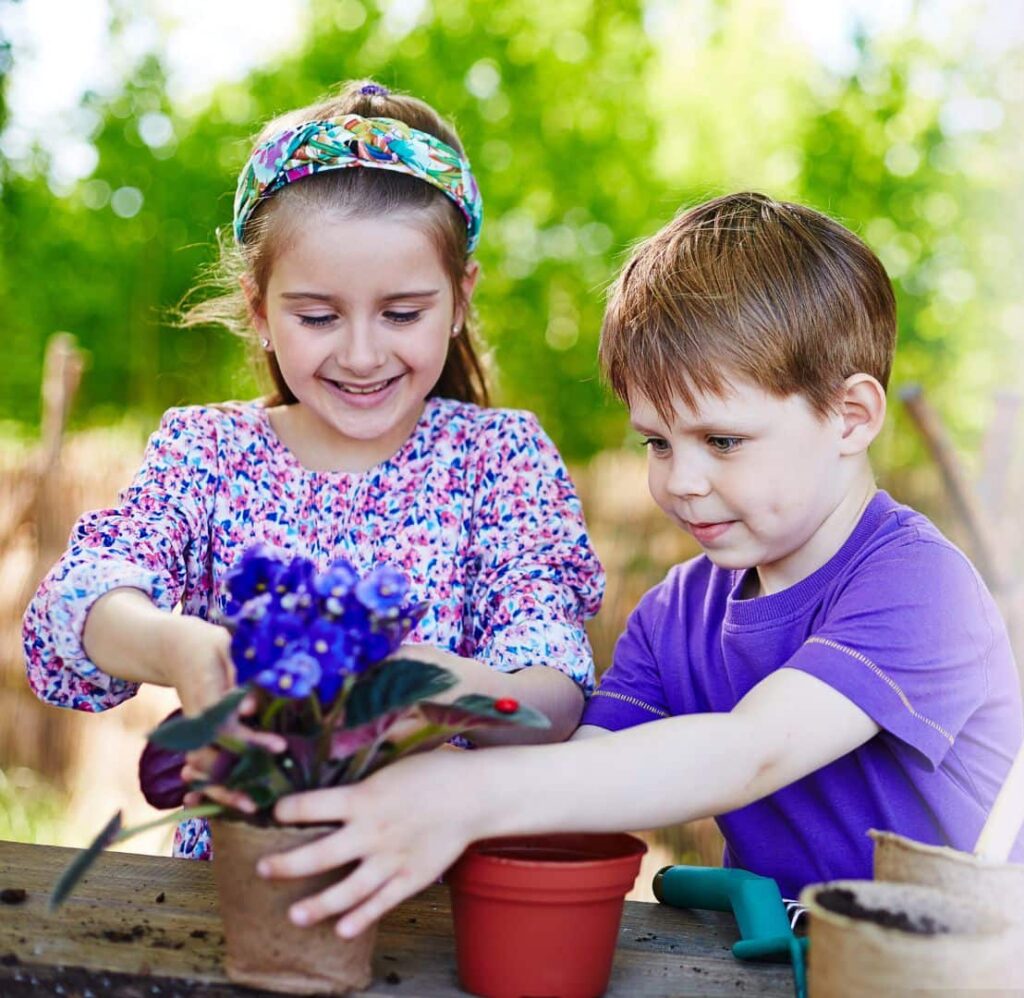 A boy and girl are planting flowers, struggling with OCD tendencies.